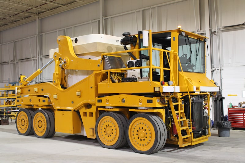 A picture of 2 OPG new dry storage container (DSC) transporters that leveraged MEDATech's electric vehicle powertrain design services