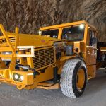 A picture of MEDATech's EV Boom Truck. A battery powered electric mine truck