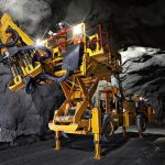 A picture of the battery electric underground roof bolter in a mine
